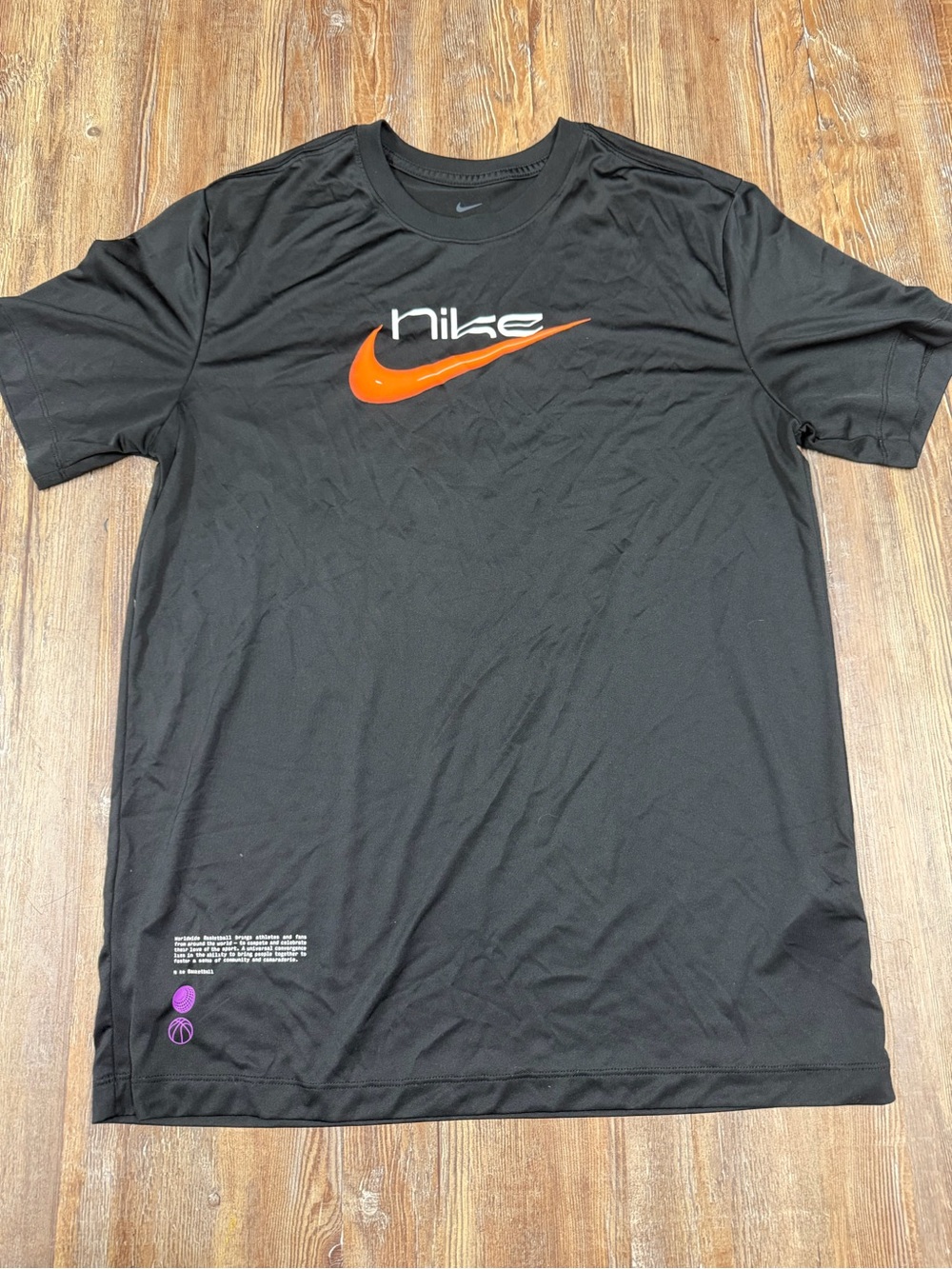 Nike Dri-Fit black t-shirt with orange Nike swoosh and logo, size M